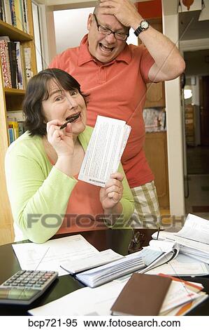 Couple paying bills View Large Photo Image Stock Photography - Couple paying bills. Fotosearch