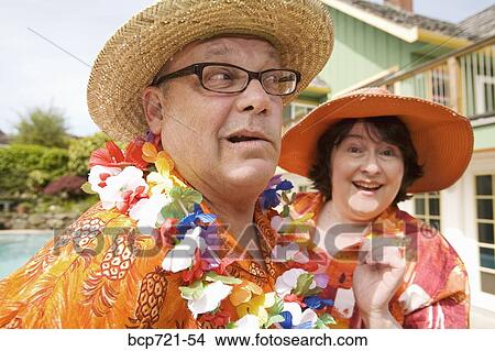 Couple wearing festive outfits View Large Photo Image Picture - Couple wearing festive outfits. Fotosearch