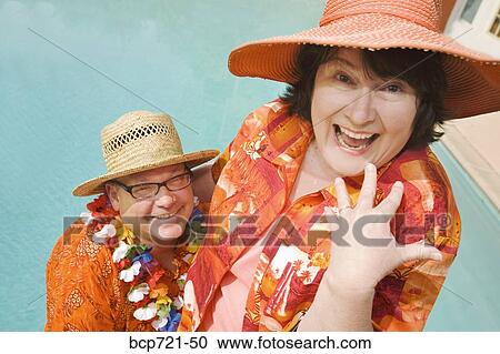 Couple wearing festive outfits View Large Photo Image Stock Image - Couple wearing festive outfits. Fotosearch