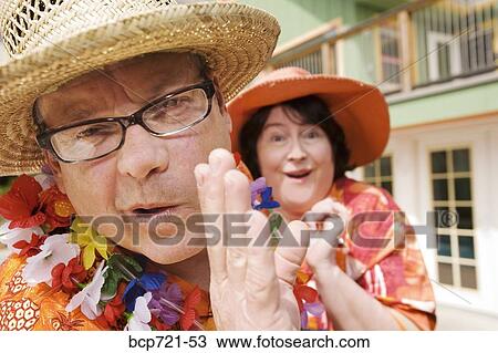 Stock Image - Couple wearing festive outfits. Fotosearch