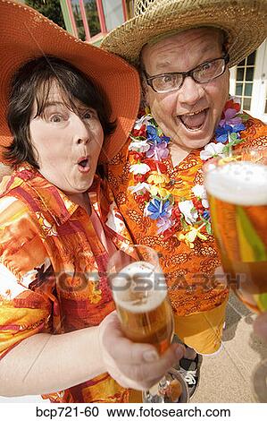 Couple wearing festive outfits View Large Photo Image Stock Image - Couple wearing festive outfits. Fotosearch