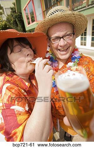 Couple wearing festive outfits View Large Photo Image Stock Image - Couple wearing festive outfits. Fotosearch