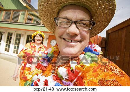 Couple wearing festive outfits View Large Photo Image Stock Photo - Couple wearing festive outfits. Fotosearch