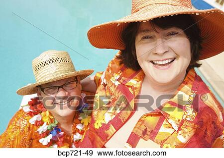 Couple wearing festive outfits View Large Photo Image Stock Photo - Couple wearing festive outfits. Fotosearch