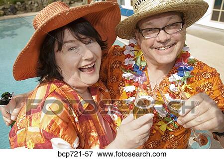 Couple wearing festive outfits View Large Photo Image Stock Photo - Couple wearing festive outfits. Fotosearch
