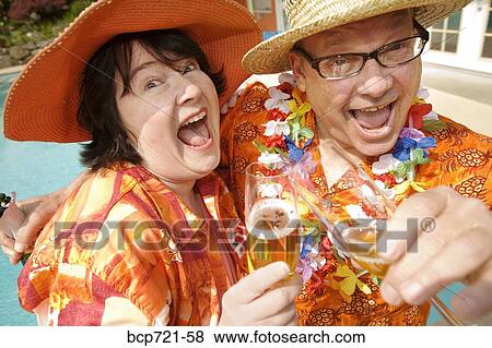 Couple wearing festive outfits View Large Photo Image Stock Photo - Couple wearing festive outfits. Fotosearch