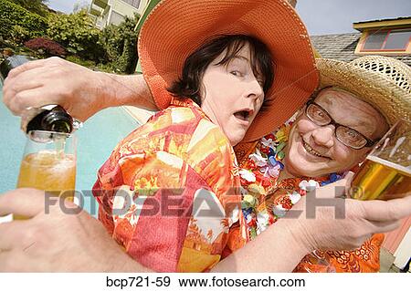 Couple wearing festive outfits View Large Photo Image Stock Photo - Couple wearing festive outfits. Fotosearch