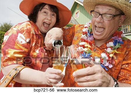 Couple wearing festive outfits View Large Photo Image Stock Photograph - Couple wearing festive outfits. Fotosearch