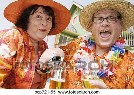 Couple wearing festive outfits View Large Photo Image Stock Photography - Couple wearing festive outfits. Fotosearch