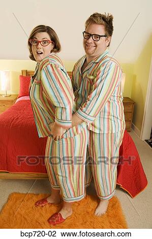 Couple wearing matching pajamas View Large Photo Image Stock Image - Couple wearing matching pajamas. Fotosearch