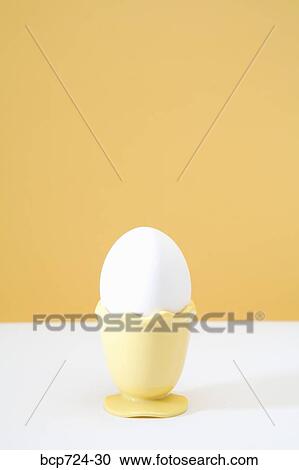 Egg in egg cup View Large Photo Image Stock Image - Egg in egg cup. Fotosearch