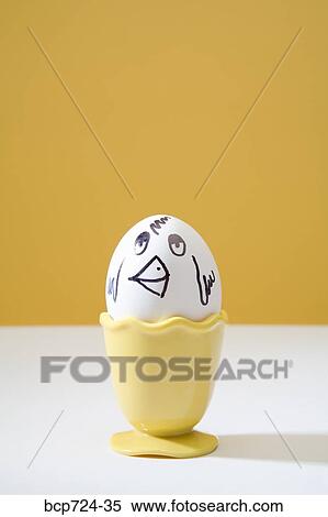 Egg with chicken face in egg cup View Large Photo Image Stock Photography - Egg with chicken face in egg cup. Fotosearch