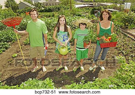 Family in vegetable garden View Large Photo Image Stock Image - Family in vegetable garden. Fotosearch