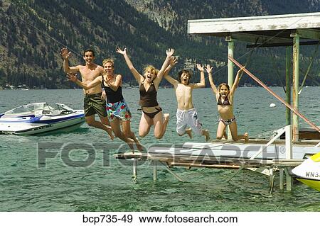 Stock Photo - Family jumping into water. Fotosearch