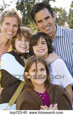 Family posing outside View Large Photo Image Stock Image - Family posing outside. Fotosearch