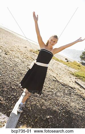 Girl in party dress outdoors View Large Photo Image Stock Image - Girl in party dress outdoors. Fotosearch
