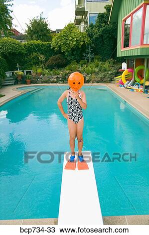 Girl with balloon in front of face over swimming pool View Large Photo Image Stock Image - Girl with balloon in front of face over swimming pool. Fotosearch