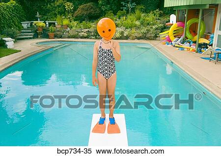 Girl with balloon in front of face over swimming pool View Large Photo Image Stock Photography - Girl with balloon in front of face over swimming pool. Fotosearch