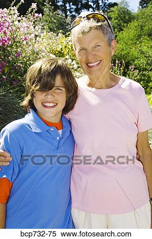 Grandmother and grandson hugging View Large Photo Image Stock Photography - Grandmother and grandson hugging. Fotosearch