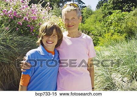 Grandmother and grandson hugging View Large Photo Image Stock Photography - Grandmother and grandson hugging. Fotosearch