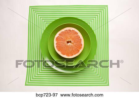 Grapefruit in green bowl View Large Photo Image Stock Photo - Grapefruit in green bowl. Fotosearch