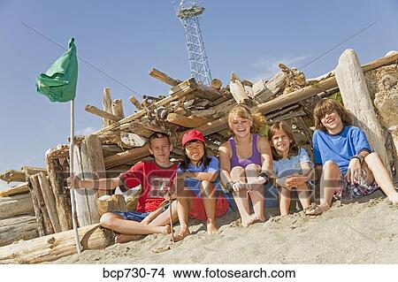 Group of children in beach fort View Large Photo Image Picture - Group of children in beach fort. Fotosearch