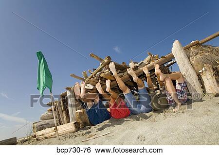Group of children in beach fort View Large Photo Image Stock Photograph - Group of children in beach fort. Fotosearch