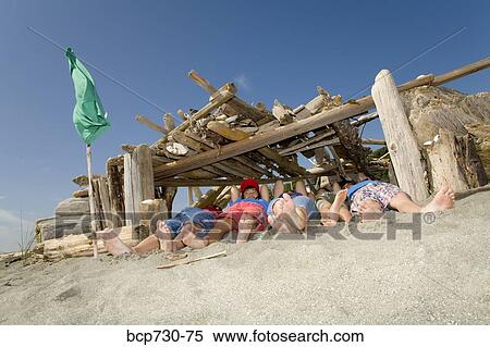 Group of children in beach fort View Large Photo Image Stock Photography - Group of children in beach fort. Fotosearch