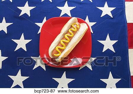 Hot dog on American flag tablecloth View Large Photo Image Stock Photo - Hot dog on American flag tablecloth. Fotosearch