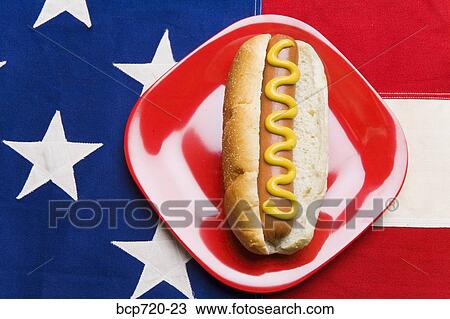 Hot dog sitting on American flag tablecloth View Large Photo Image Stock Image - Hot dog sitting on American flag tablecloth. Fotosearch