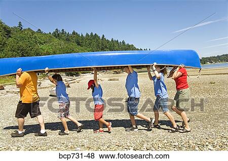 Male camp counselor and children carrying canoe View Large Photo Image Stock Photo - Male camp counselor and children carrying canoe. Fotosearch
