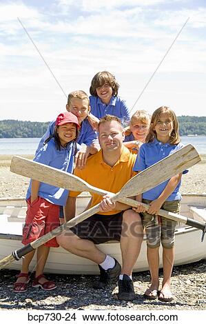 Male camp counselor with children at beach View Large Photo Image Picture - Male camp counselor with children at beach. Fotosearch