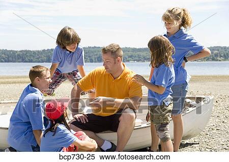 Male camp counselor with children at beach View Large Photo Image Stock Photography - Male camp counselor with children at beach. Fotosearch