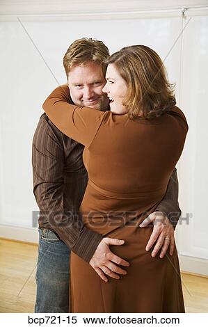 Stock Photography - Man groping his wife. Fotosearch