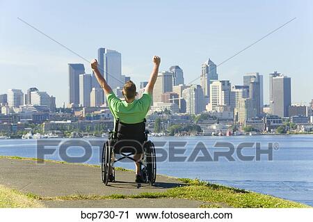 Man in wheelchair looking at city skyline View Large Photo Image Stock Image - Man in wheelchair looking at city skyline. Fotosearch