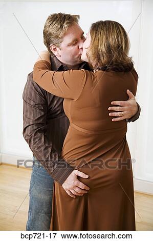 Man kissing his wife View Large Photo Image Stock Photo - Man kissing his wife. Fotosearch