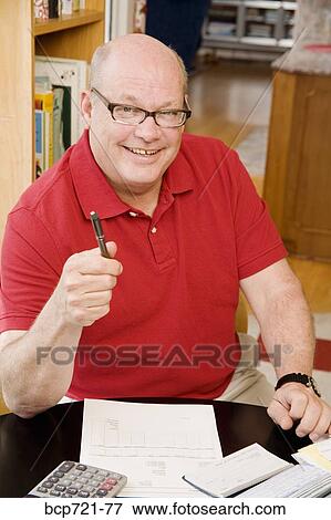 Man paying bills View Large Photo Image Stock Photo - Man paying bills. Fotosearch