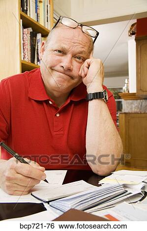 Man paying bills View Large Photo Image Stock Photograph - Man paying bills. Fotosearch