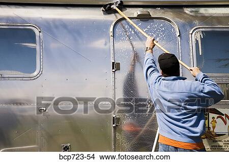 Man scrubbing recreational vehicle View Large Photo Image Picture - Man scrubbing recreational vehicle. Fotosearch