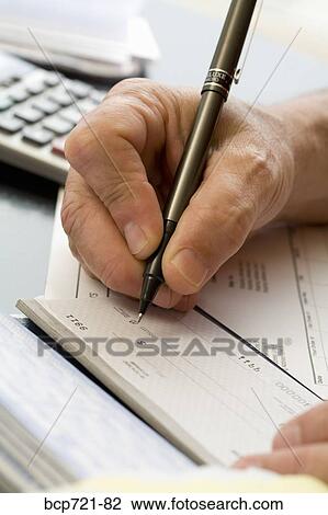 Man writing a check View Large Photo Image Stock Image - Man writing a check. Fotosearch