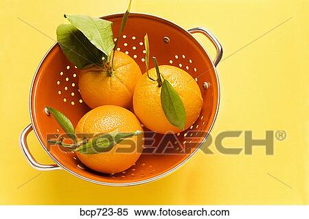Stock Photography - Oranges in colander. Fotosearch
