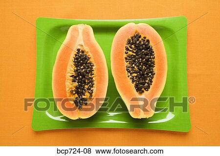 Papaya on green plate View Large Photo Image Stock Photo - Papaya on green plate. Fotosearch