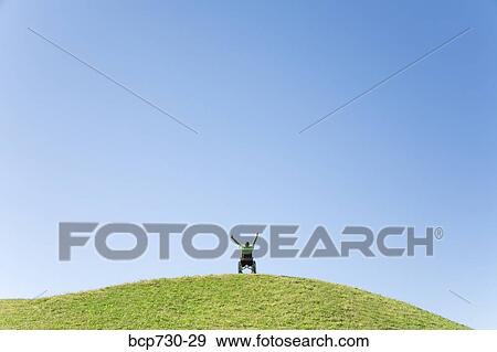 Person in wheelchair on top of hill View Large Photo Image Stock Photo - Person in wheelchair on top of hill. Fotosearch