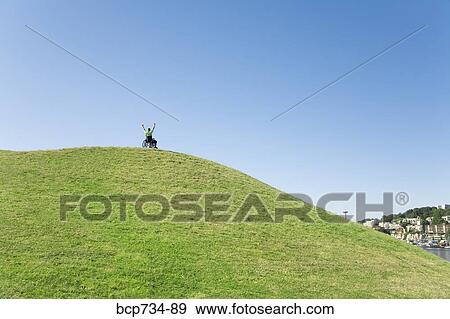 Person in wheelchair on top of hill View Large Photo Image Stock Photo - Person in wheelchair on top of hill. Fotosearch