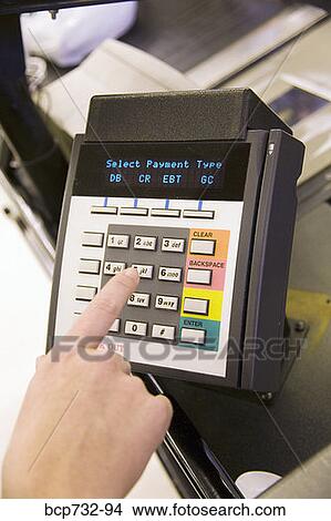 Person using debit card transaction machine View Large Photo Image Picture - Person using debit card transaction machine. Fotosearch