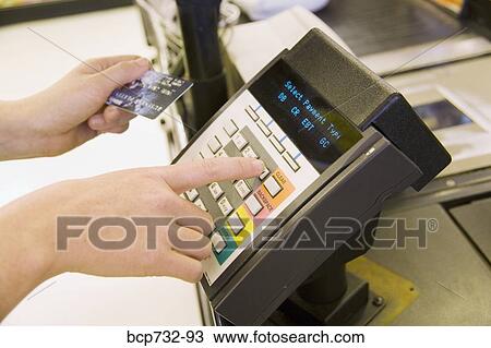 Person using debit card transaction machine View Large Photo Image Stock Image - Person using debit card transaction machine. Fotosearch