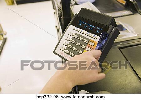 Person using debit card transaction machine View Large Photo Image Stock Photograph - Person using debit card transaction machine. Fotosearch