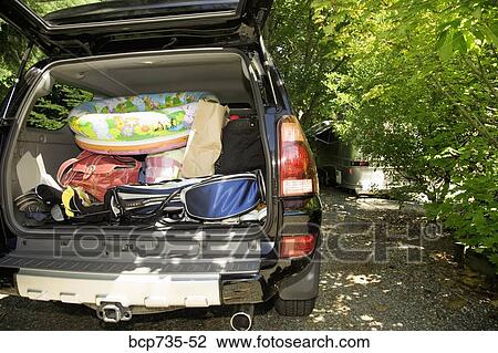Rear view of truck packed for vacation View Large Photo Image Stock Image - Rear view of truck packed for vacation. Fotosearch