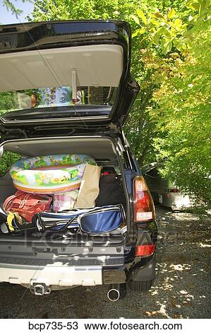 Rear view of truck packed for vacation View Large Photo Image Stock Image - Rear view of truck packed for vacation. Fotosearch