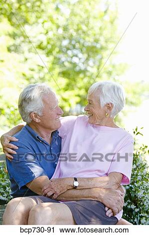 Senior couple smiling at each other View Large Photo Image Stock Image - Senior couple smiling at each other. Fotosearch